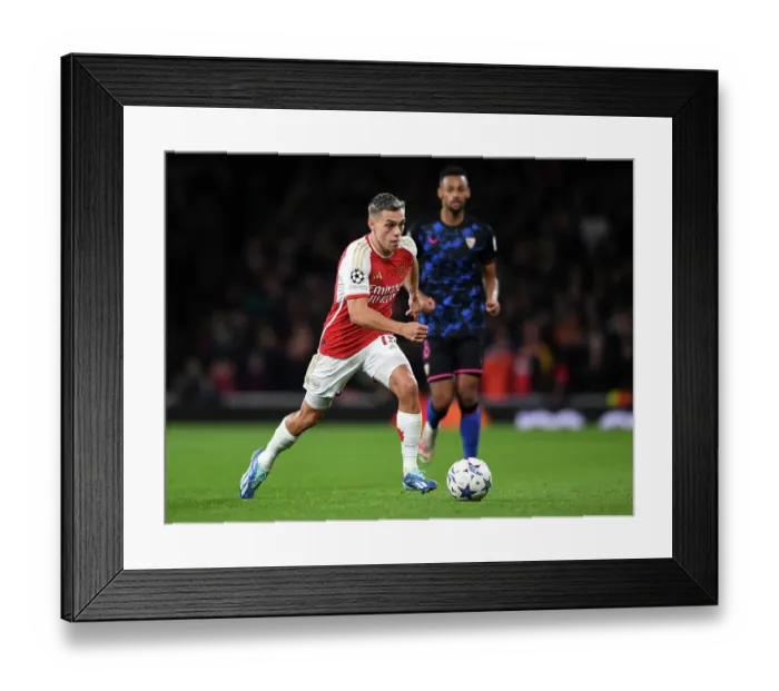 Framed Print : Arsenal FC vs Sevilla FC: Trossard Dashes Through Emirates Stadium in 2023-24 UEFA Champions League