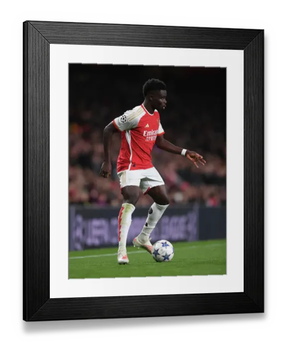 Framed Print : Arsenal's Bukayo Saka Shines in Champions League Clash Against Sevilla Framed Print : Arsenal's Bukayo Saka Shines in Champions League Clash Against Sevilla