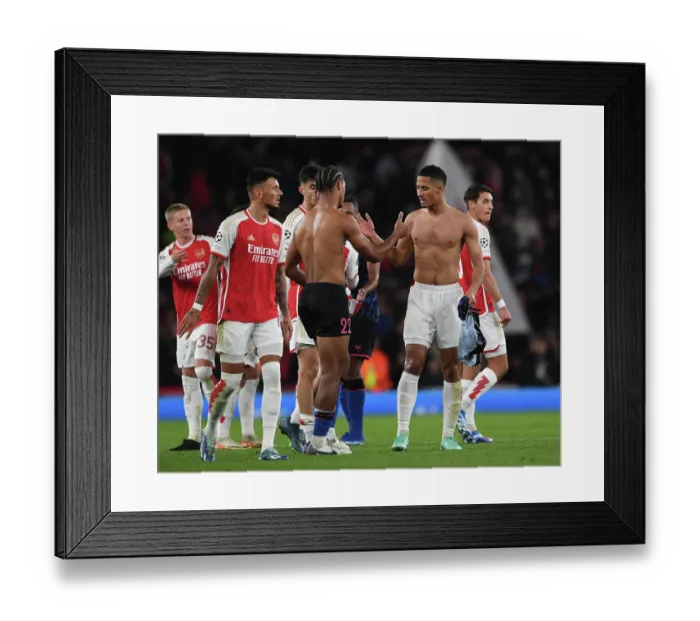 Framed Print : Arsenal's Saliba and Bade Exchange Shirts after Exciting Arsenal FC vs Sevilla FC UCL Clash, 2023-24 Framed Print : Arsenal's Saliba and Bade Exchange Shirts after Exciting Arsenal FC vs Sevilla FC UCL Clash, 2023-24