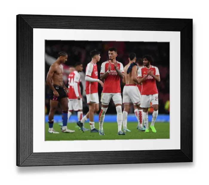 Framed Print : Arsenal Celebrate Victory Over Sevilla in Champions League Group Stage