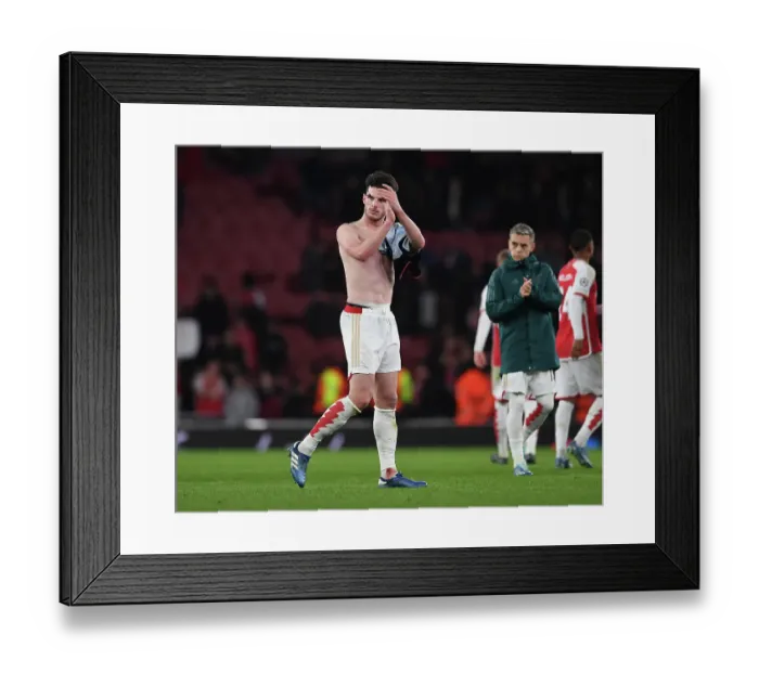 Framed Print : Arsenal Champions League Triumph: Declan Rice Rallies Fans in Victory Over Sevilla