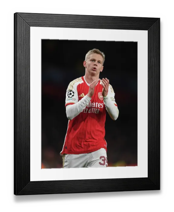 Framed Print : Arsenal's Oleksandr Zinchenko Celebrates with Fans after Victory over Sevilla in 2023-24 UEFA Champions League