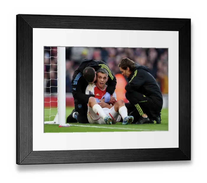 Framed Print : Arsenal's Trossard Scores First Goal, Receives Treatment in Arsenal v Burnley Premier League Clash (2023-24)