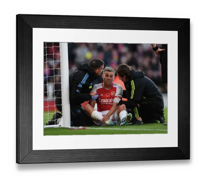 Framed Print : Trossard Scores and Receives Treatment: Arsenal's First Goal Against Burnley (2023-24) Framed Print : Trossard Scores and Receives Treatment: Arsenal's First Goal Against Burnley (2023-24)