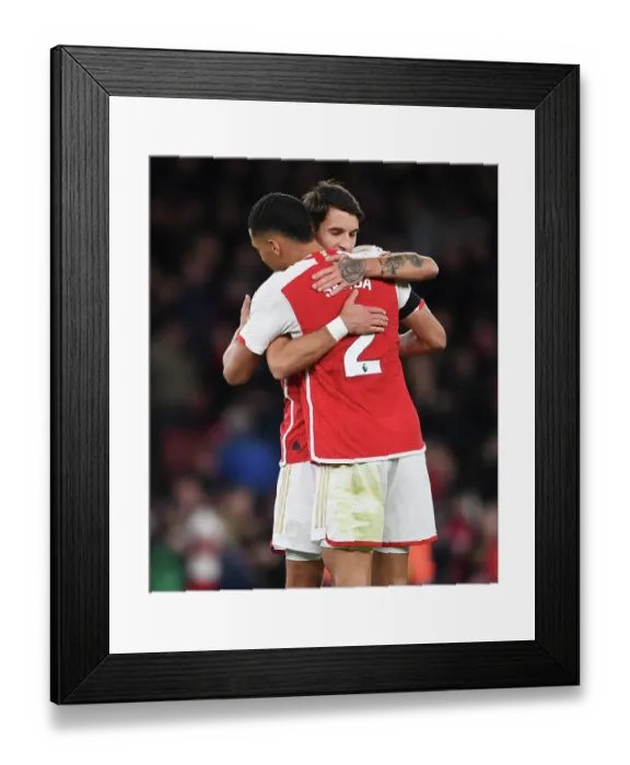 Framed Print : Arsenal's Kiwior and Saliba Celebrate Victory Over Burnley in 2023-24 Premier League