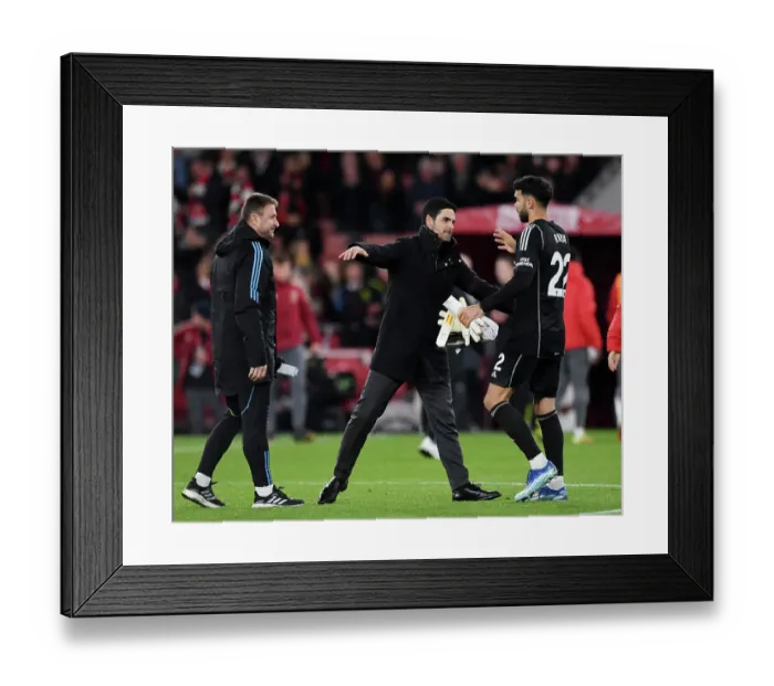 Framed Print : Arsenal's Victory: Mikel Arteta Celebrates with David Raya after Arsenal v Burnley in 2023-24 Premier League