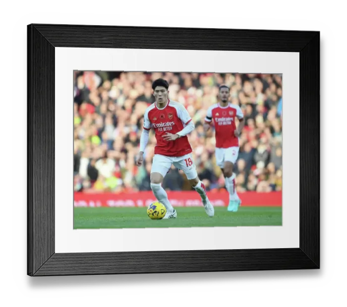 Framed Print : Arsenal's Tomiyasu Charges Forward Against Burnley in Premier League Showdown (2023-24)