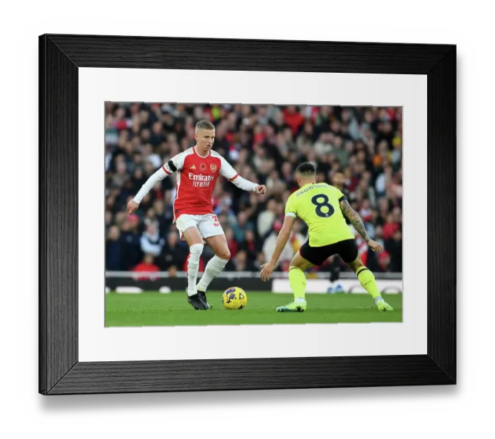 Framed Print : Arsenal's Zinchenko Fends Off Burnley's Brownhill in Premier League Clash Framed Print : Arsenal's Zinchenko Fends Off Burnley's Brownhill in Premier League Clash