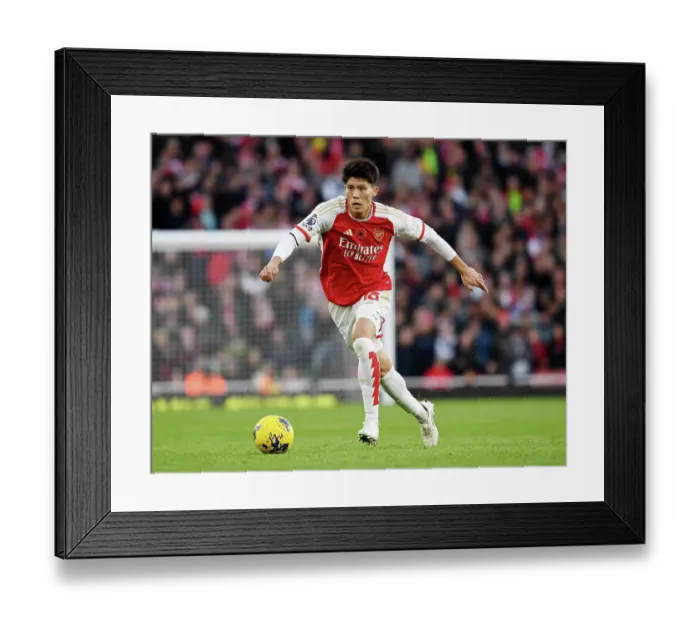 Framed Print : Arsenal's Tomiyasu Charges Forward in Premier League Battle Against Burnley (2023-24) Framed Print : Arsenal's Tomiyasu Charges Forward in Premier League Battle Against Burnley (2023-24)