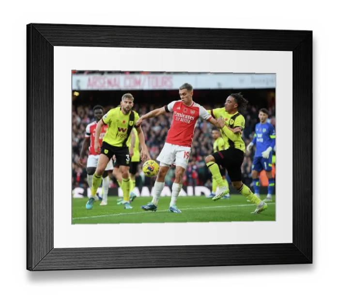 Framed Print : Arsenal vs Burnley: Trossard vs Koleosho - Intense Battle at Emirates Stadium (Premier League 2023-24)