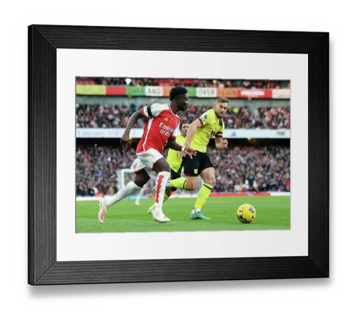 Framed Print : Arsenal's Bukayo Saka Evades Burnley's Charlie Taylor: Premier League Showdown at Emirates Stadium (2023-24)