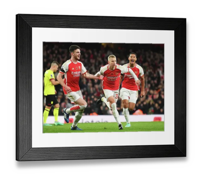Framed Print : Arsenal's Triumph: Zinchenko, Rice, and Saliba's Euphoric Celebration After Scoring the Third Goal vs. Burnley (2023-24)