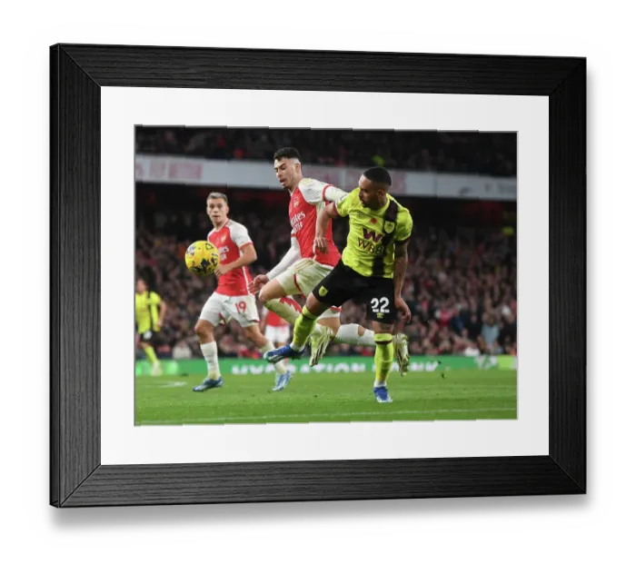 Framed Print : Martinelli vs. Vitinho: Intense Showdown in Arsenal's Battle Against Burnley (2023-24)