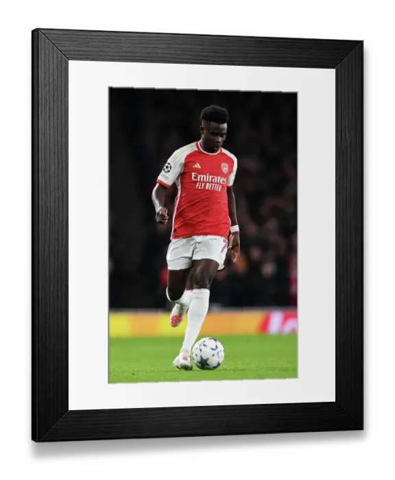 Framed Print : Arsenal's Bukayo Saka in Action against Sevilla in 2023-24 UEFA Champions League Framed Print : Arsenal's Bukayo Saka in Action against Sevilla in 2023-24 UEFA Champions League