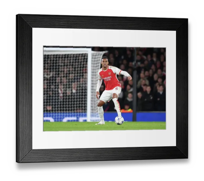 Framed Print : Arsenal's Gabriel Battles for Possession in 2023-24 Champions League Match Against Sevilla