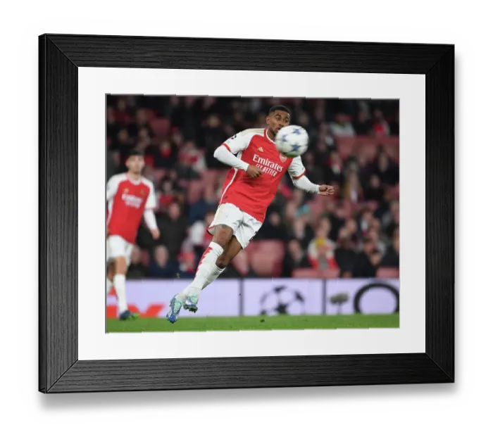 Framed Print : Reiss Nelson's Battle: Arsenal FC vs Sevilla FC in the UEFA Champions League Group Stage 2023 / 24