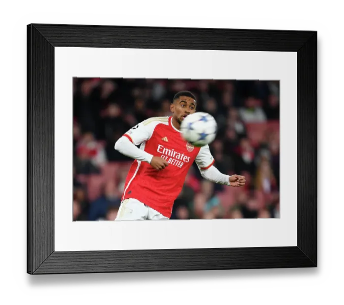 Framed Print : Reiss Nelson's Unwavering Focus: Arsenal's Determined Battle against Sevilla in the 2023 / 24 UEFA Champions League Framed Print : Reiss Nelson's Unwavering Focus: Arsenal's Determined Battle against Sevilla in the 2023 / 24 UEFA Champions League