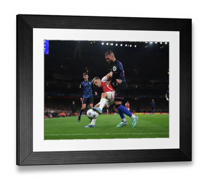 Framed Print : Arsenal vs. Sevilla Showdown: Trossard vs. Gudelj - Champions League Clash (2023-24)