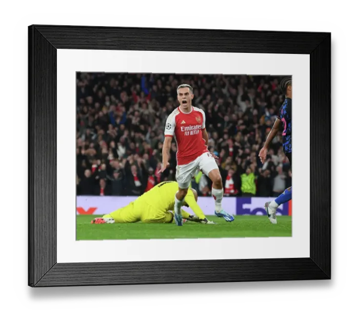 Framed Print : Arsenal Takes the Lead: Leandro Trossard Scores First Goal Against Sevilla in 2023-24 UEFA Champions League