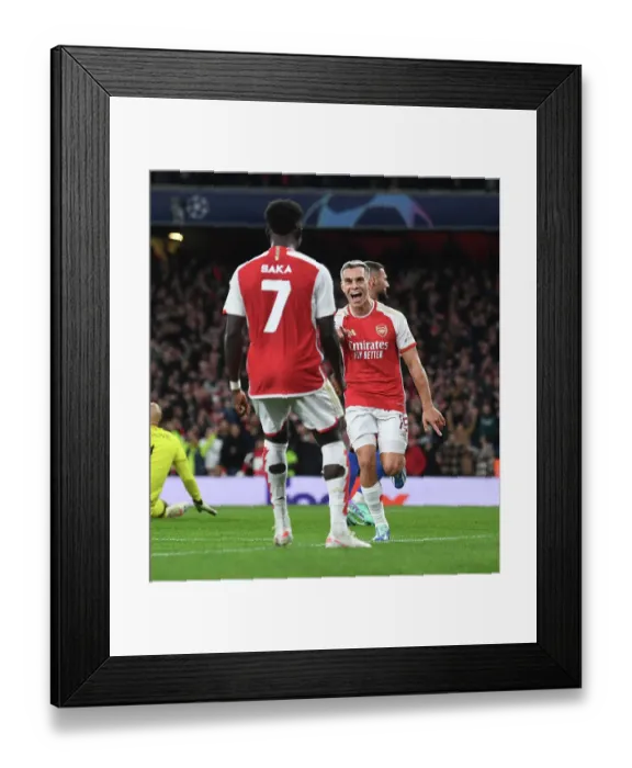 Framed Print : Arsenal's Trossard and Saka Celebrate First Goal vs Sevilla in 2023-24 Champions League Framed Print : Arsenal's Trossard and Saka Celebrate First Goal vs Sevilla in 2023-24 Champions League