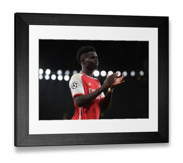 Framed Print : Arsenal's Bukayo Saka Bids Farewell to Fans Amidst Arsenal FC vs Sevilla FC UCL Clash, 2023 / 24