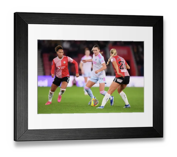 Framed Print : Conti Cup Clash: Southampton Women vs. Arsenal Women at St. Mary's Stadium - Arsenal's Maritz Fends Off Pressure from Southampton's Lloyd-Smith and Purfield