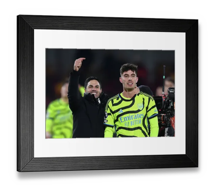 Framed Print : Arsenal's Victory at Brentford: Mikel Arteta and Kai Havertz Celebrate