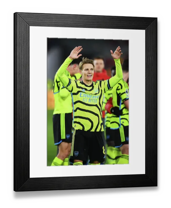 Framed Print : Martin Odegaard's Celebration: Arsenal Secures Victory Over Brentford in 2023-24 Premier League