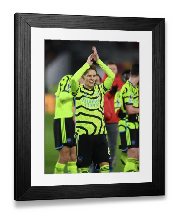 Framed Print : Martin Odegaard's Euphoric Moment: Arsenal Secures Triumph Over Brentford in 2023-24 Premier League Framed Print : Martin Odegaard's Euphoric Moment: Arsenal Secures Triumph Over Brentford in 2023-24 Premier League