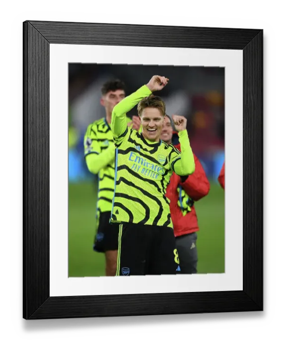 Framed Print : Martin Odegaard's Goal Celebration: Arsenal Secures Victory Over Brentford in 2023-24 Premier League