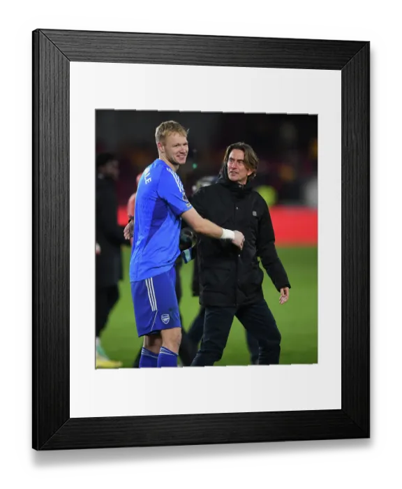 Framed Print : Brentford Manager Thomas Frank and Arsenal's Aaron Ramsdale Share Post-Match Moment after Brentford v Arsenal (2023-24)