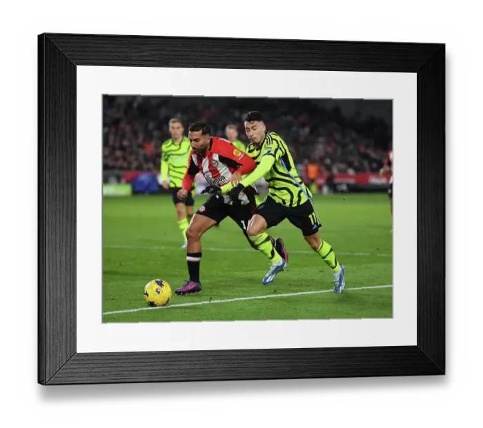 Framed Print : Martinelli vs. Ghoddos: Clash of the Wings in Brentford v Arsenal (2023-24)