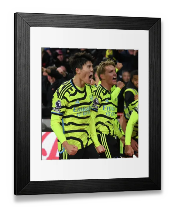 Framed Print : Arsenal's Tomiyasu and Odegaard Celebrate Goal Against Brentford in 2023-24 Premier League Framed Print : Arsenal's Tomiyasu and Odegaard Celebrate Goal Against Brentford in 2023-24 Premier League