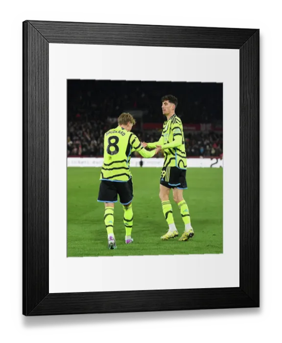 Framed Print : Havertz and Odegaard Celebrate Arsenal's Goal: Brentford vs Arsenal, Premier League 2023-24