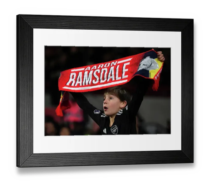 Framed Print : Young Arsenal Fan Celebrates Victory: Brentford FC vs. Arsenal FC, Premier League 2023-24