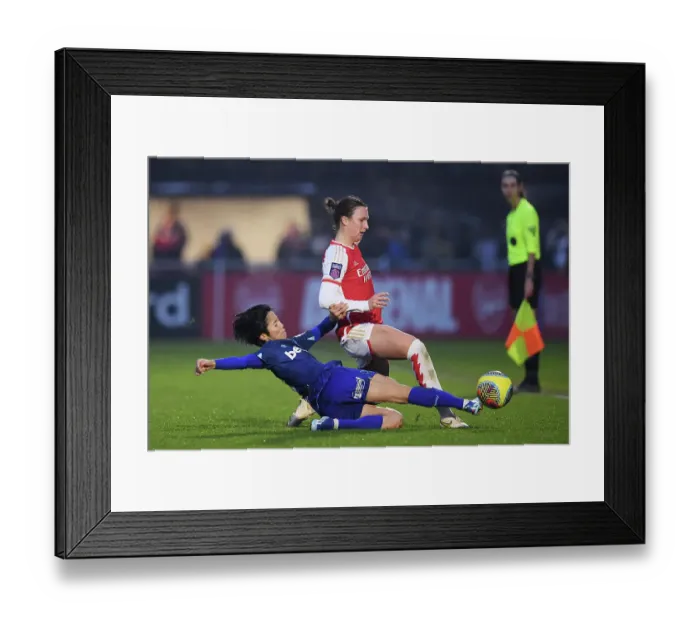 Framed Print : Intense Battle: Arsenal Women vs. West Ham United in Barclays Women's Super League
