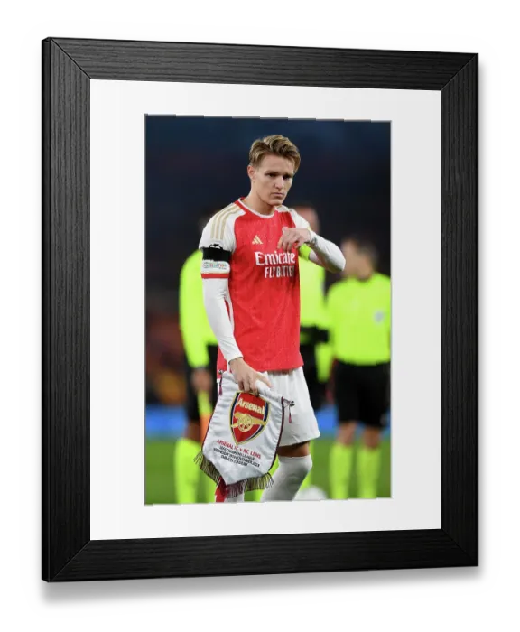 Framed Print : Martin Odegaard's Unwavering Determination: Arsenal's Champion's League Battle against RC Lens (2023 / 24) Framed Print : Martin Odegaard's Unwavering Determination: Arsenal's Champion's League Battle against RC Lens (2023 / 24)