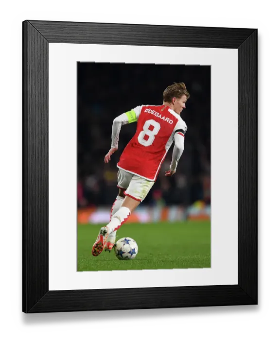 Framed Print : Charging Ahead: Martin Odegaard's Determined Push in Arsenal's UEFA Champions League Battle against RC Lens Framed Print : Charging Ahead: Martin Odegaard's Determined Push in Arsenal's UEFA Champions League Battle against RC Lens