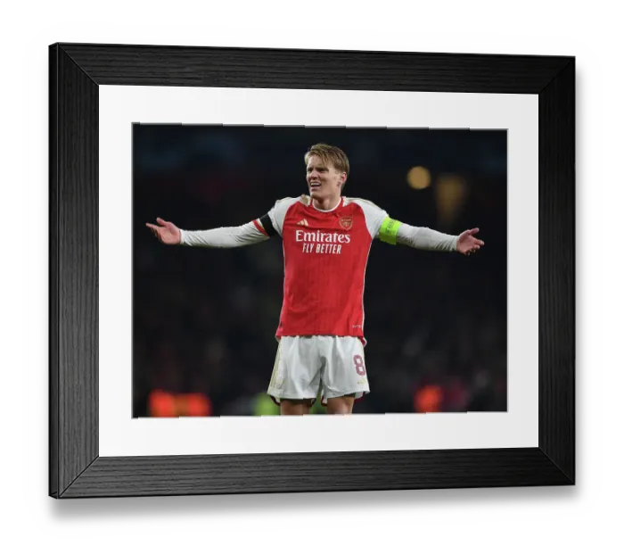 Framed Print : Arsenal's Martin Odegaard Shines in Champions League Clash Against RC Lens