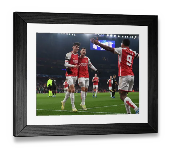 Framed Print : Arsenal's Havertz and Martinelli Celebrate First Goal in 2023-24 Champions League Victory over RC Lens