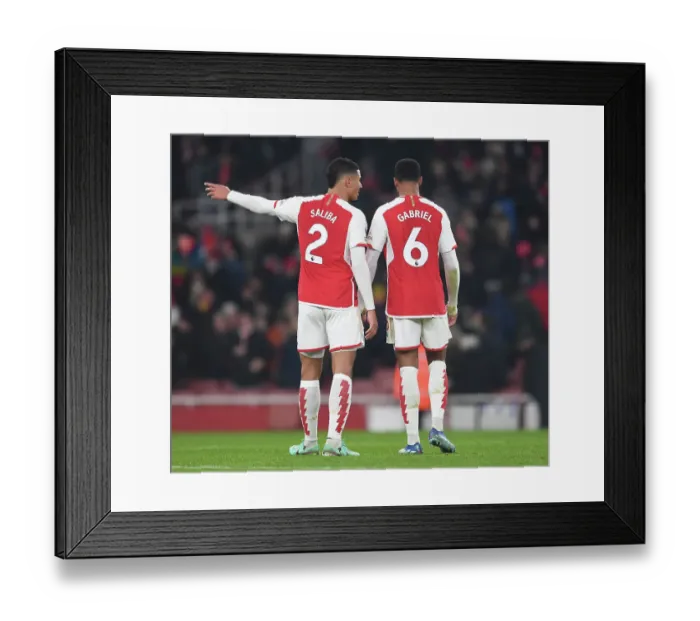 Framed Print : Arsenal's Defense Duo: Saliba and Magalhaes Celebrate after Arsenal v Wolverhampton Wanderers in 2023-24 Premier League Framed Print : Arsenal's Defense Duo: Saliba and Magalhaes Celebrate after Arsenal v Wolverhampton Wanderers in 2023-24 Premier League