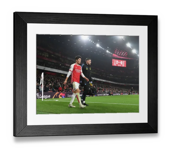 Framed Print : Arsenal's Tomiyasu Injured, Escorted Off Pitch During Arsenal v Wolverhampton Wanderers (2023-24) Framed Print : Arsenal's Tomiyasu Injured, Escorted Off Pitch During Arsenal v Wolverhampton Wanderers (2023-24)