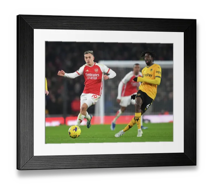 Framed Print : Arsenal's Trossard Chases Down Traore in Intense 2023-24 Premier League Showdown Framed Print : Arsenal's Trossard Chases Down Traore in Intense 2023-24 Premier League Showdown