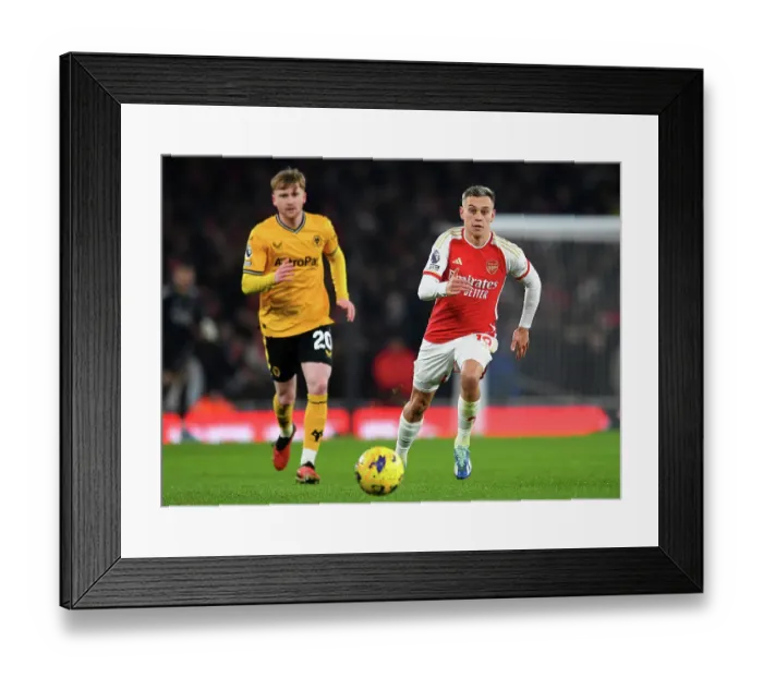 Framed Print : Arsenal's Trossard Sprints Past Wolves in 2023-24 Premier League Clash