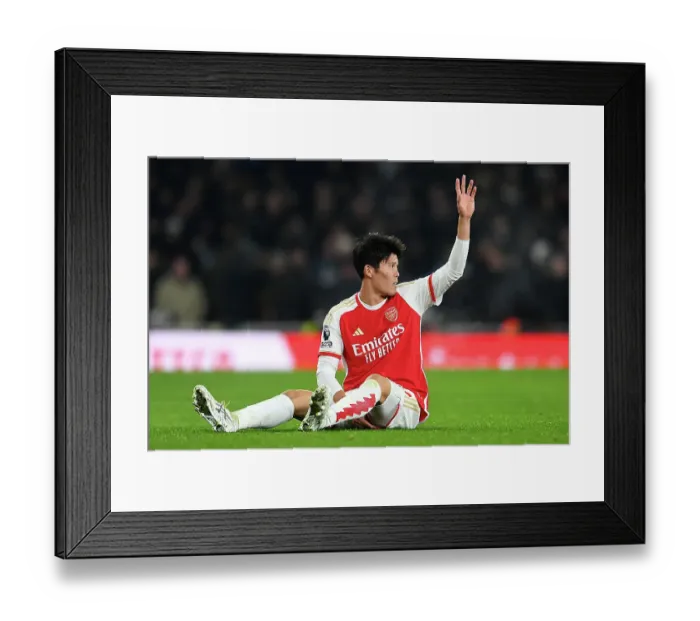 Framed Print : Arsenal's Tomiyasu Suffers Injury in Arsenal v Wolverhampton Wanderers Premier League Clash (2023-24)