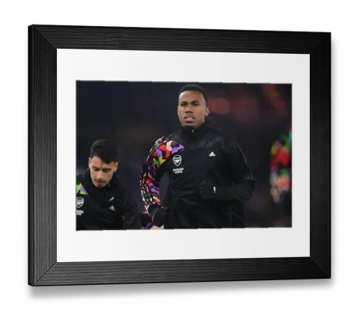 Framed Print : Arsenal's Gabriel Warms Up Ahead of Luton Town Clash (2023-24 Premier League)