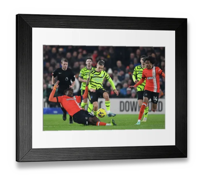Framed Print : Arsenal's Trossard Faces Off Against Luton Duo in Premier League Clash Framed Print : Arsenal's Trossard Faces Off Against Luton Duo in Premier League Clash