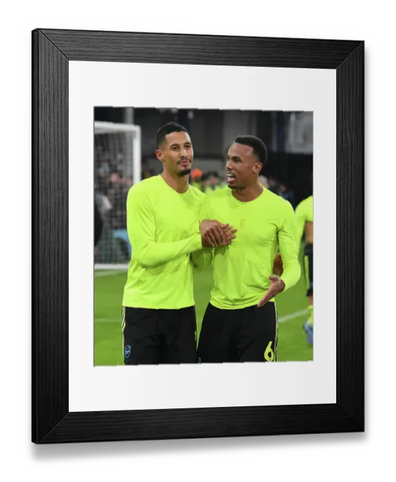 Framed Print : Arsenal's Defenders Gabriel Magalhaes and William Saliba Celebrate Victory over Luton Town (2023-24)