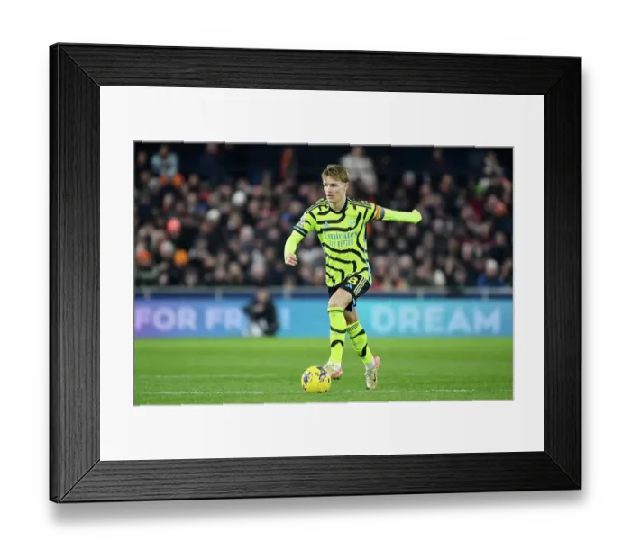 Framed Print : Martin Odegaard Charges Forward: Luton Town vs. Arsenal FC, Premier League 2023-24 Framed Print : Martin Odegaard Charges Forward: Luton Town vs. Arsenal FC, Premier League 2023-24