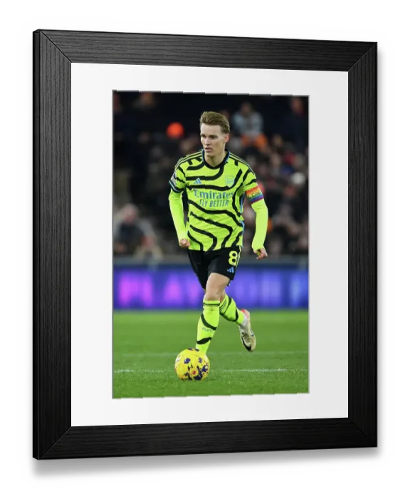 Framed Print : Martin Odegaard Charges Forward: Arsenal vs. Luton Town, Premier League 2023-24 Framed Print : Martin Odegaard Charges Forward: Arsenal vs. Luton Town, Premier League 2023-24